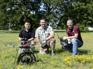 Students and professor with drone