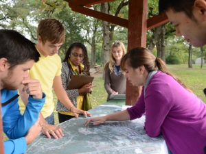 Students reviewing map