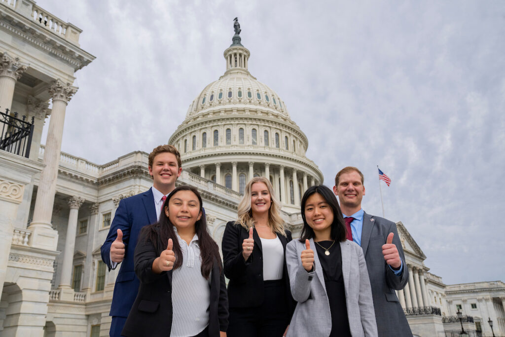 five Texas A&M AgriLife interns in Washington D.C. standing in front of Capitol Building