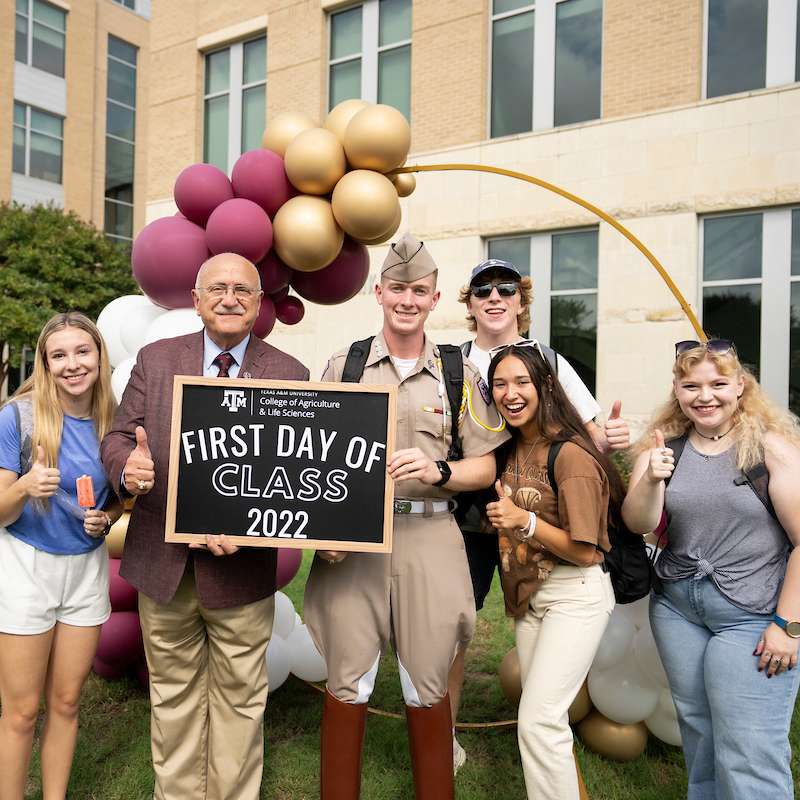students celebrating the first day of class with Dr. Jeffrey Savell