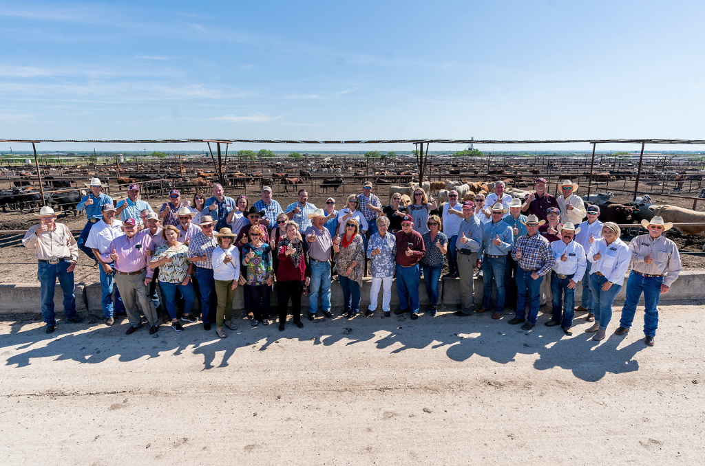 College of Agriculture Development Council standing together in front of field