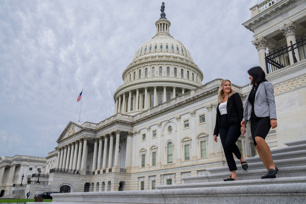 two interns walking down the capitol steps
